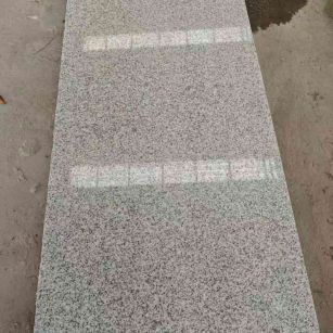 贺州芝麻白光面毛板