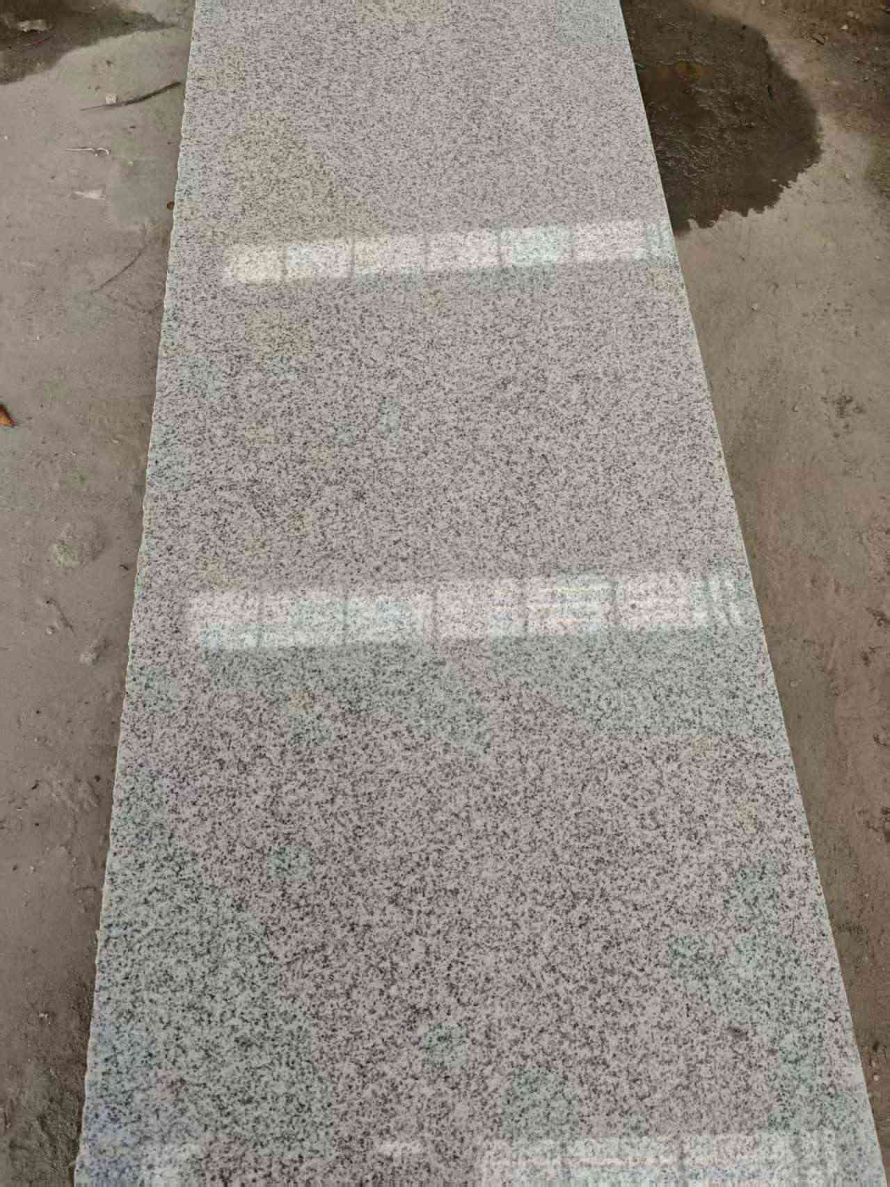 贺州芝麻白光面毛板